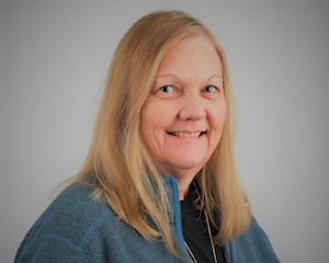 Headshot of Cindy smiling at the camera